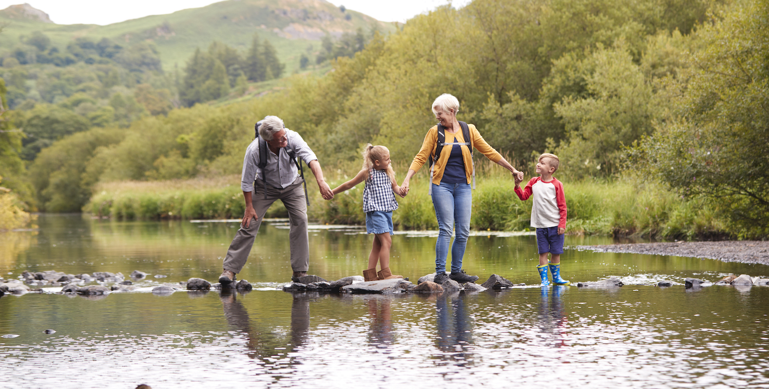 grandparents with grandchildren hiking